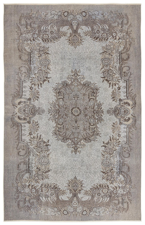 Load image 1 in gallery view. Grey and taupe traditional rug with a distressed floral medallion pattern on a white background.