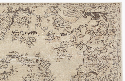 Load image 1 in gallery view. Beige rug with a dark brown traditional floral and vine pattern on a white background.