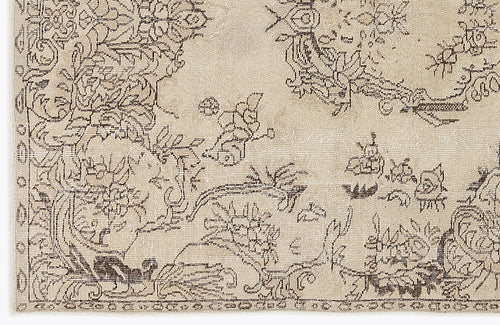 Load image 1 in gallery view. Beige rug with a dark brown distressed floral and vine pattern.