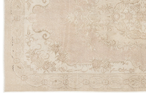 Load image 1 in gallery view. Beige monochromatic rug with a subtle, low-contrast traditional floral medallion pattern and a bordered edge.