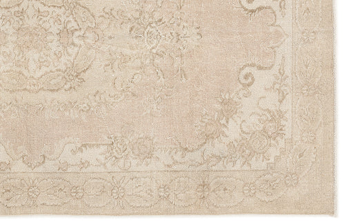 Load image 1 in gallery view. Beige monochromatic rug with a subtle, distressed traditional floral medallion pattern and a bordered edge.