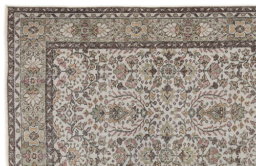 Load image 1 in gallery view. Traditional rug with a cream background, dark brown border, and intricate floral medallion pattern in sage and dusty pink.