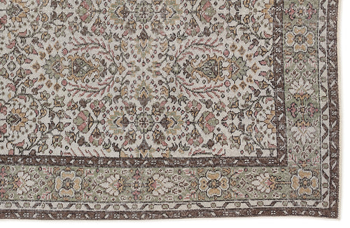 Load image 1 in gallery view. Traditional Persian-style rug with a cream field, floral medallion pattern, and a dark brown border in muted earth tones.