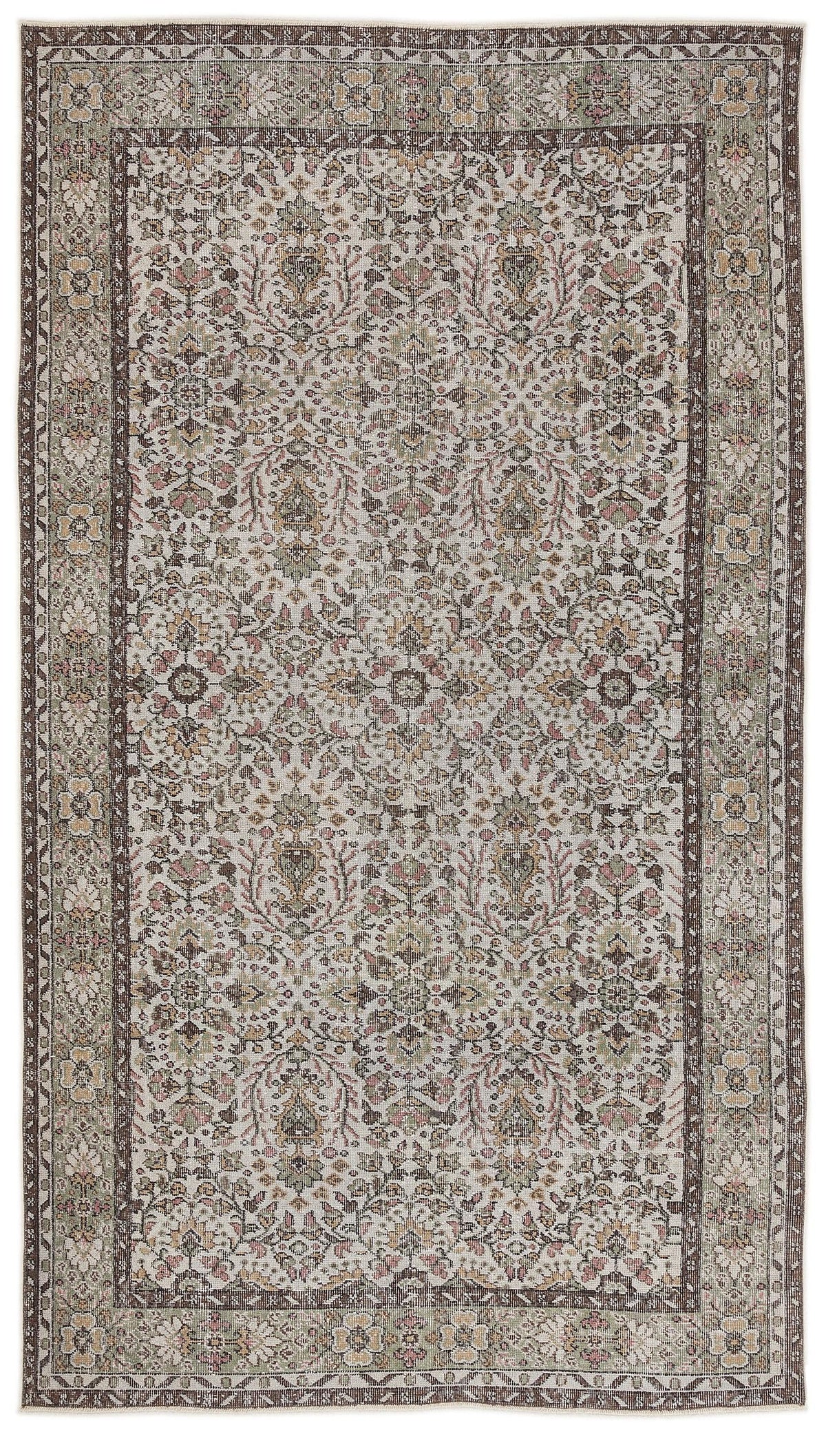 Traditional beige, brown, and sage green rug with a distressed floral medallion pattern and a wide decorative border.