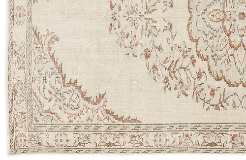 Load image 1 in gallery view. Cream and beige rug with a distressed, rust-colored floral medallion pattern and a detailed border.