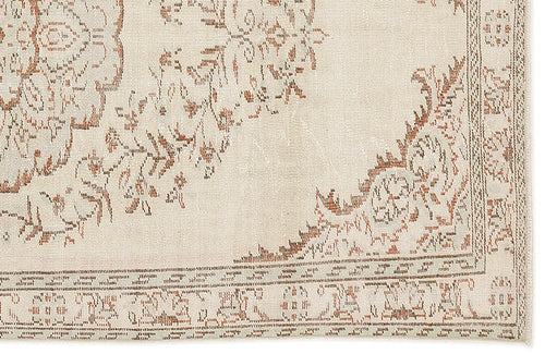 Load image 1 in gallery view. Cream and terracotta rug with a distressed traditional floral medallion pattern and a detailed border.