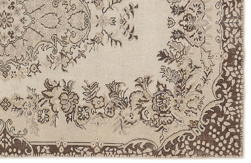Load image 1 in gallery view. Beige and dark brown rug with a traditional floral medallion pattern and a detailed decorative border.