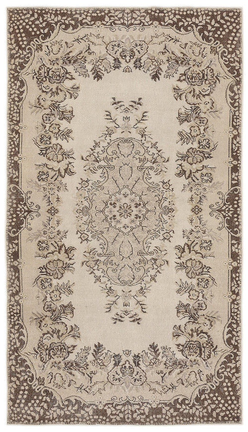 Load image 1 in gallery view. Beige and brown traditional rug with a central floral medallion and ornate border on a white background.