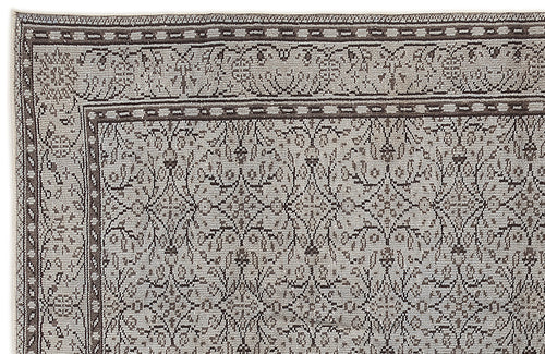Load image 1 in gallery view. Grey and brown rug with a traditional floral lattice pattern and a detailed geometric border.