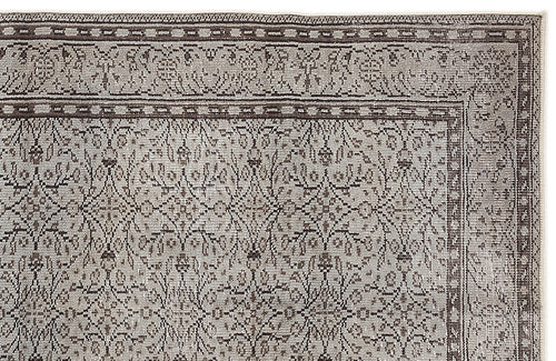 Load image 1 in gallery view. Taupe and charcoal grey rug with a traditional floral medallion pattern and a detailed border.
