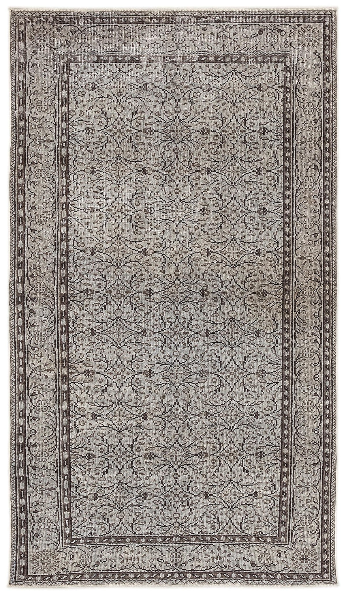 Grey and brown traditional rug with a repeating floral medallion pattern and a decorative border.