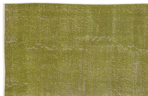 Load image 1 in gallery view. Olive green distressed rug with a subtle, faded white linear pattern on a white background.
