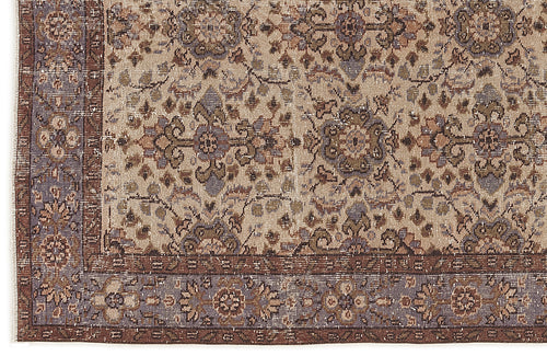 Load image 1 in gallery view. Beige, brown, and slate blue traditional rug with a distressed floral medallion pattern and a detailed border.