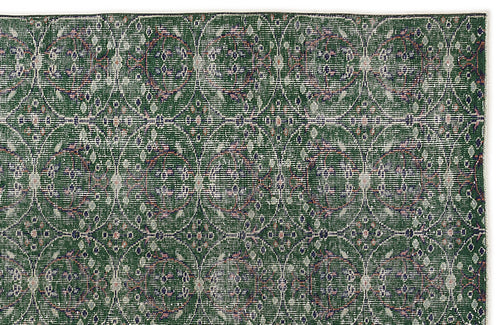 Load image 1 in gallery view. Forest green rug with a repeating white circular lattice pattern and small floral accents on a white background.