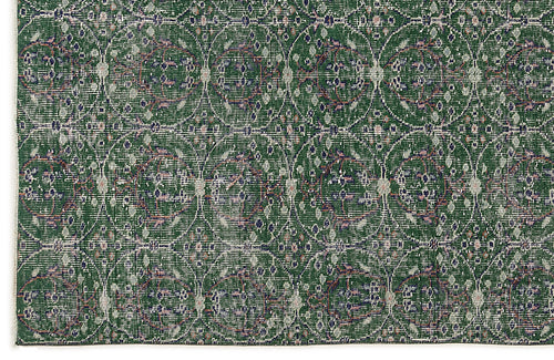 Load image 1 in gallery view. Forest green rug with a repeating white circular lattice pattern and distressed floral accents.