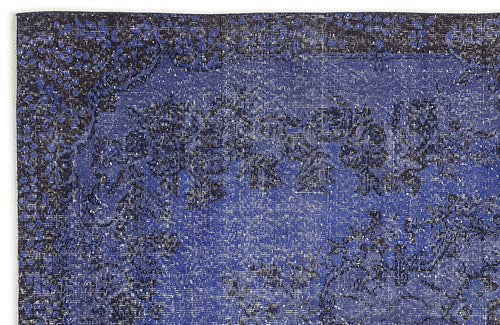 Load image 1 in gallery view. Navy and royal blue distressed rug with a traditional floral medallion pattern.