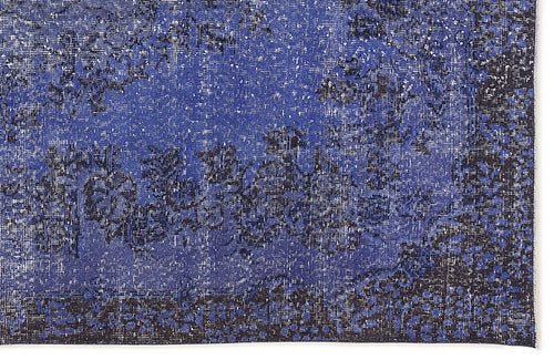 Load image 1 in gallery view. Deep blue and black distressed rug with a faded floral medallion pattern and a dark geometric border.