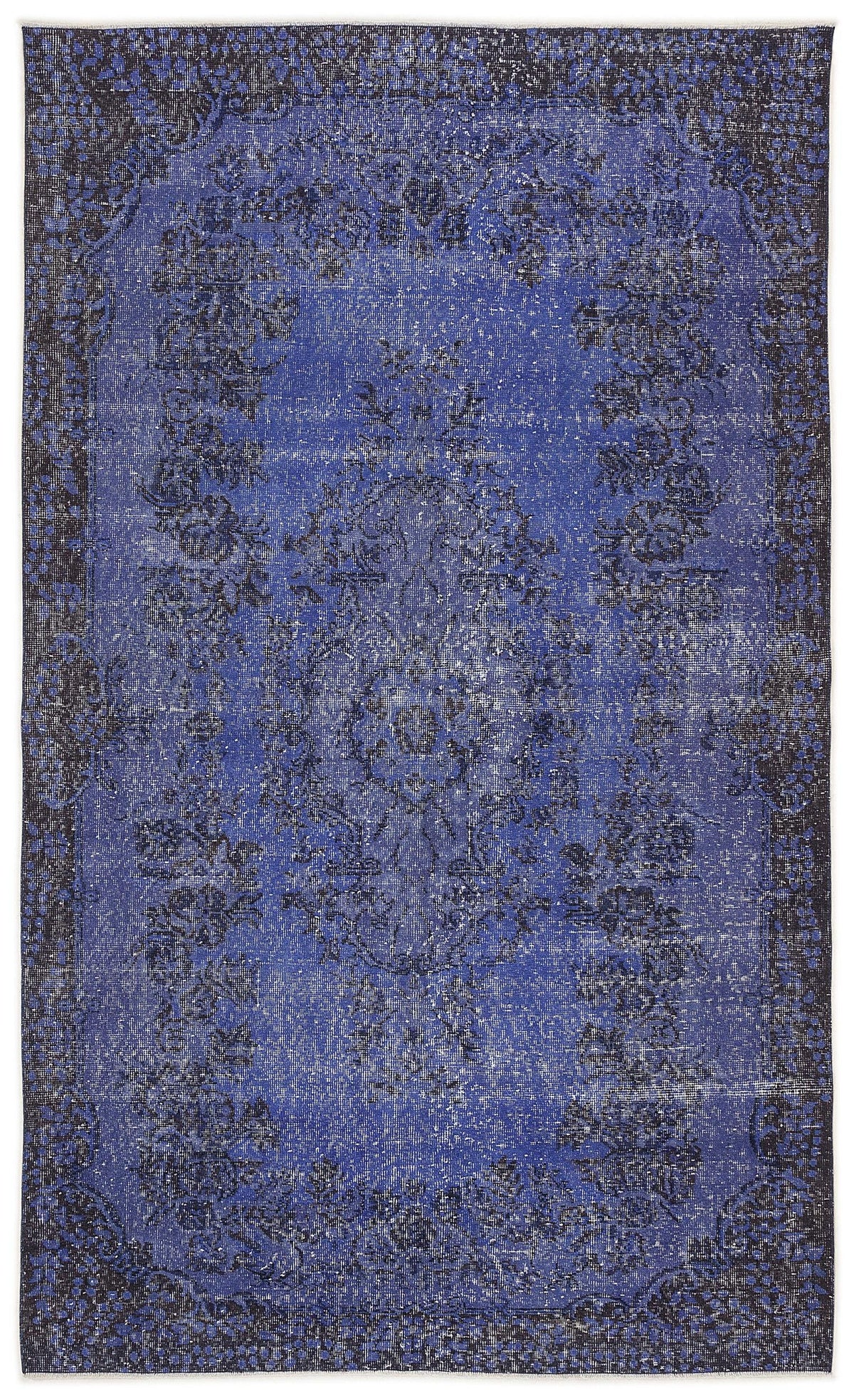 Distressed royal blue and black rug with a traditional floral medallion pattern and a wide decorative border.