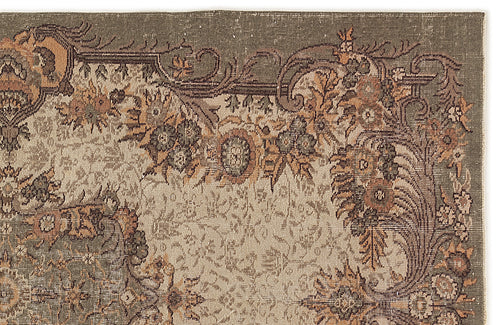 Load image 1 in gallery view. Olive green and beige rug with a distressed traditional floral border and intricate central medallion pattern.