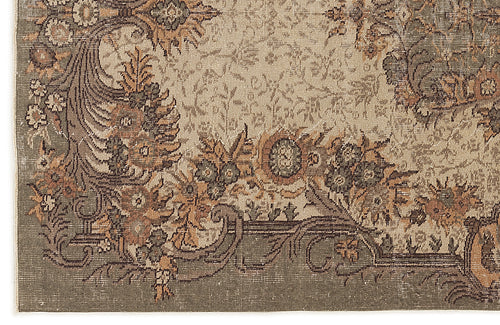 Load image 1 in gallery view. Sage green and tan traditional rug with a distressed floral medallion pattern and ornate border.