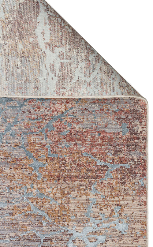 Load image 1 in gallery view. Distressed abstract rug in rust, grey, and beige with a folded corner revealing the woven backing.