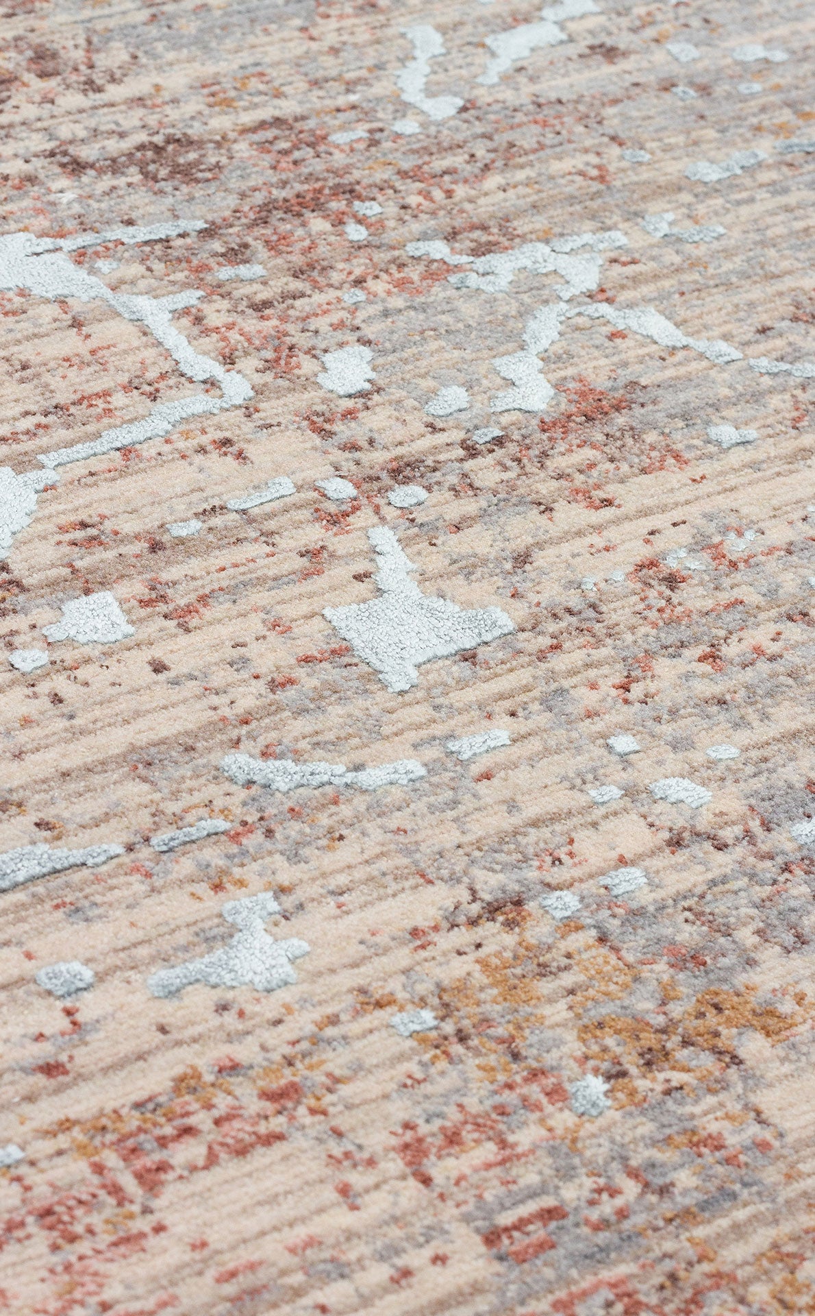 Beige, rust, and light blue abstract rug with a textured, distressed pile and linear ribbed pattern.