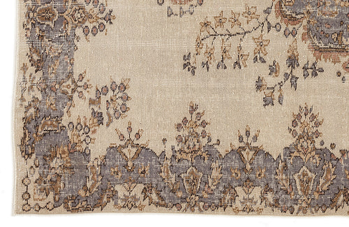 Load image 1 in gallery view. Beige rug with a distressed grey and brown floral border and scattered botanical motifs.