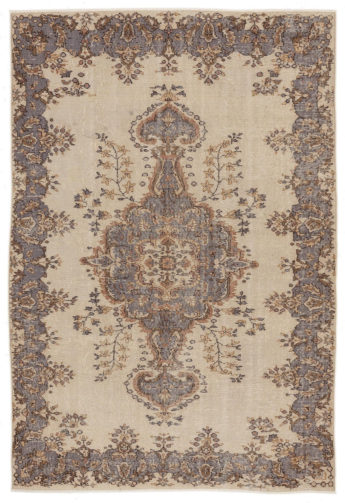 Beige rug with a central grey and brown floral medallion and a matching ornate border in a distressed vintage style.