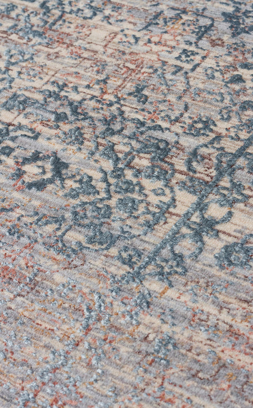 Load image 1 in gallery view. Beige, blue, and rust-colored distressed rug with a faded traditional medallion pattern and textured pile.