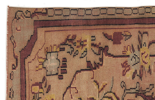 Load image 1 in gallery view. Tan and brown hand-knotted rug with a geometric border and stylized floral motifs in yellow, maroon, and grey.