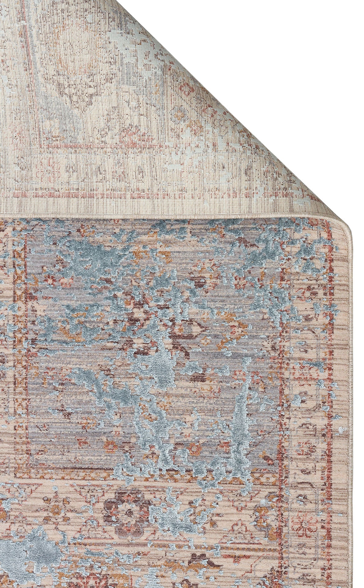 Beige and blue distressed traditional rug with a faded medallion pattern, shown with a corner folded over.