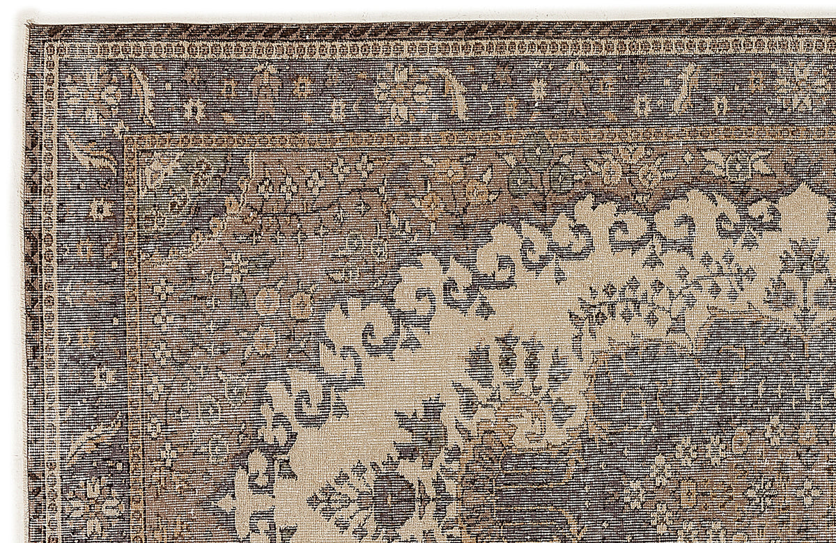 Charcoal and beige traditional rug with an intricate floral medallion border and ornate, distressed patterns.