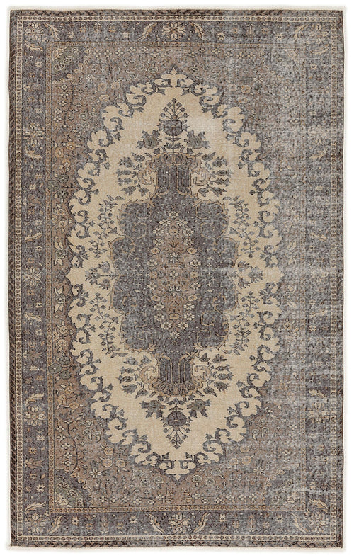 Load image 1 in gallery view. Charcoal and beige vintage-style rug with a central floral medallion and distressed border pattern.