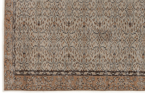 Load image 1 in gallery view. Beige and brown rug with a distressed, intricate geometric pattern and a wide, ornate border.