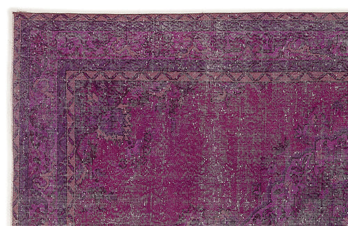 Load image 1 in gallery view. Deep purple distressed rug with a traditional border and faded medallion pattern on a white background.