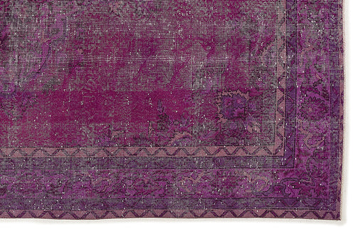 Load image 1 in gallery view. Deep purple distressed rug with a faded traditional medallion pattern and a geometric border.