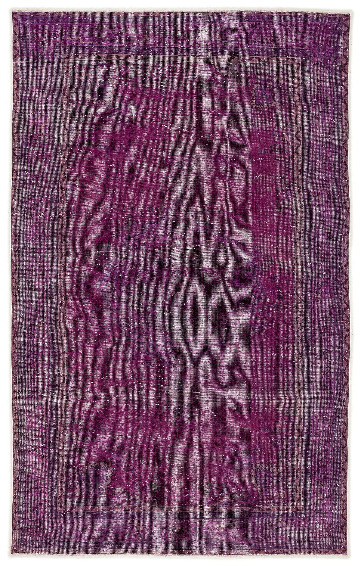 Deep magenta distressed vintage-style rug with a faded central medallion and geometric border.
