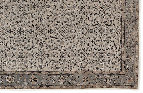 Load image 1 in gallery view. Grey and beige vintage-style rug with a repeating floral medallion pattern and a detailed border.