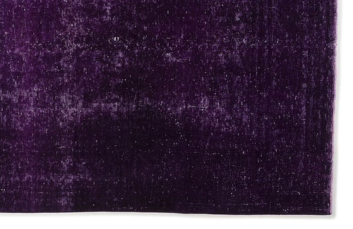 Load image 1 in gallery view. Deep purple rug with a distressed, weathered texture and subtle white flecks on a white background.