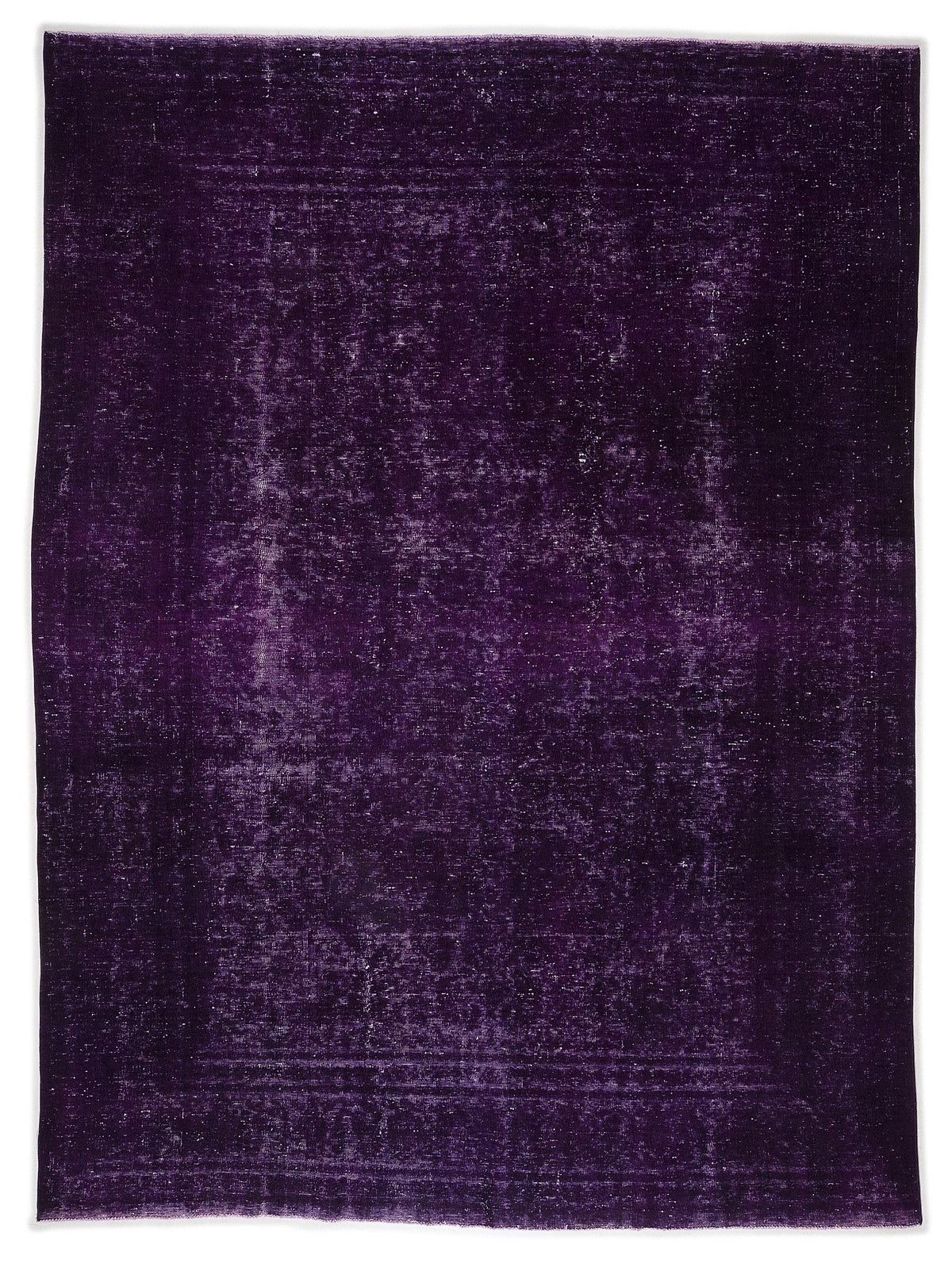 Deep purple overdyed vintage rug with a distressed, faded texture and subtle rectangular border pattern.