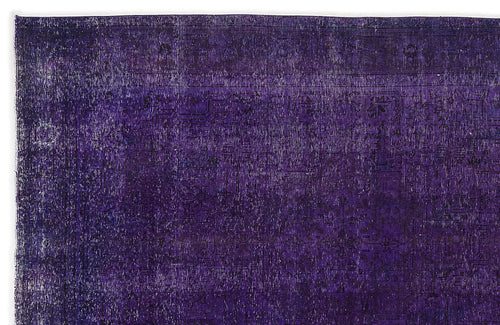 Load image 1 in gallery view. Deep purple vintage-style rug with a faint, distressed traditional medallion pattern.