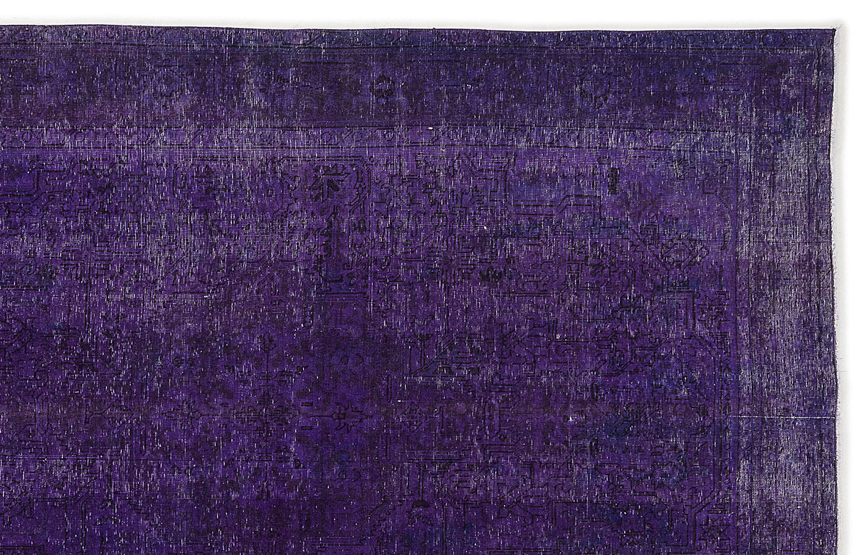 Deep purple vintage-style rug with a faint, distressed traditional medallion pattern on a white background.