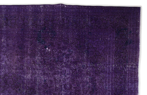 Load image 1 in gallery view. Deep purple vintage-style rug with a distressed, faded traditional floral border and central medallion pattern.