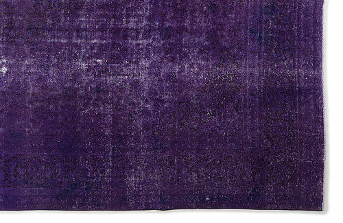 Load image 1 in gallery view. Deep purple vintage-style rug with a distressed, faded traditional medallion pattern on a white background.
