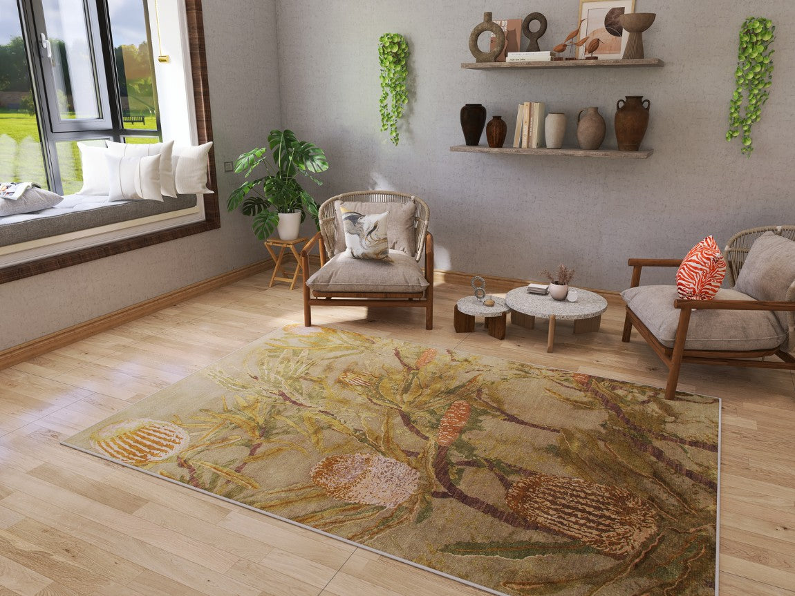 A cozy living room with wooden floors, a Dreamweaver's Loom Washable Rug (JRS001), cushioned chairs, a plant, wall shelves with vases, hanging potted plants, and a window seat with white pillows overlooking greenery.