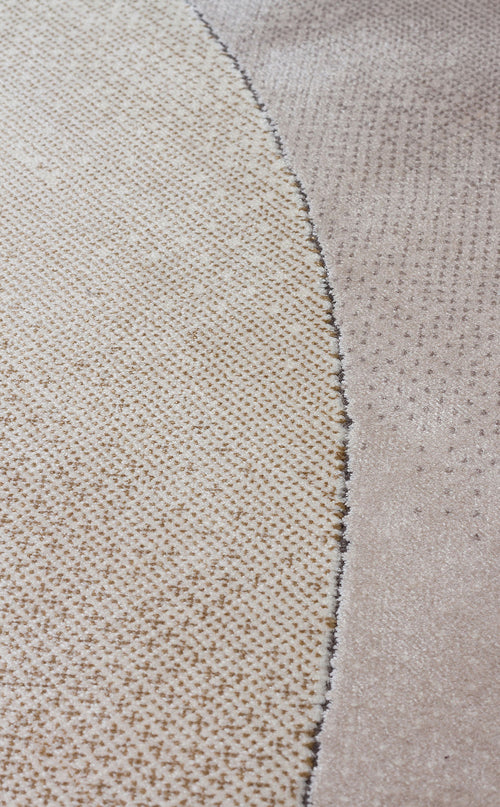 Load image 1 in gallery view. Beige and taupe rug with a curved, textured dotted pattern and a high-pile border.