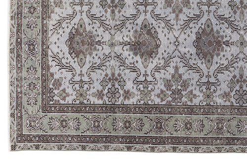 Load image 1 in gallery view. Grey and brown traditional rug with a distressed floral medallion pattern and a detailed border.