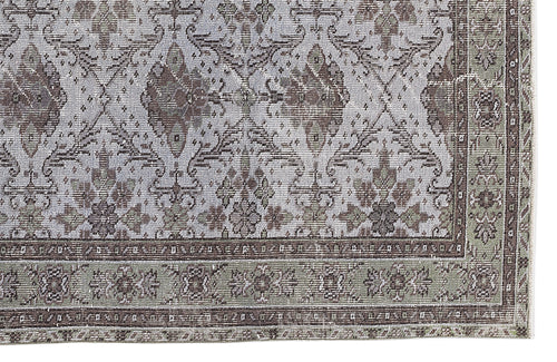 Load image 1 in gallery view. Distressed sage green and grey traditional rug with a faded floral medallion pattern and a detailed border.