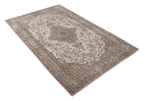 Load image 1 in gallery view. Beige and dusty rose vintage-style rug with a central floral medallion and intricate border pattern on a white background.