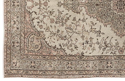 Load image 1 in gallery view. Beige and muted pink traditional rug with a distressed floral medallion pattern and a detailed geometric border.